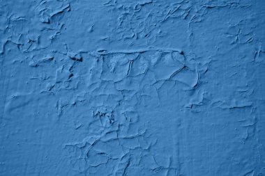 Ahşap arka planda eski soyulmuş boya. Klasik mavi renk.