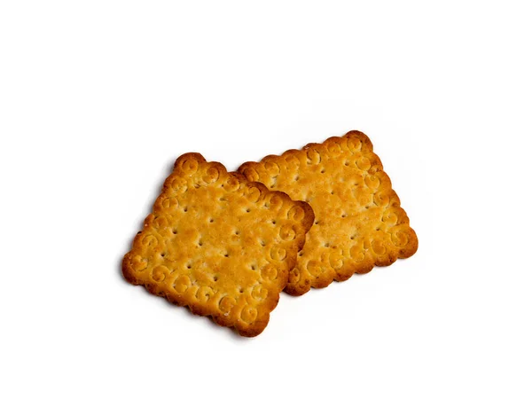 Cracker koekjes met zout, vierkante vorm geïsoleerd op een witte achtergrond — Stockfoto