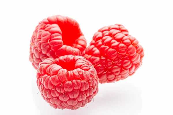 Ripe raspberries on a white background Stock Picture