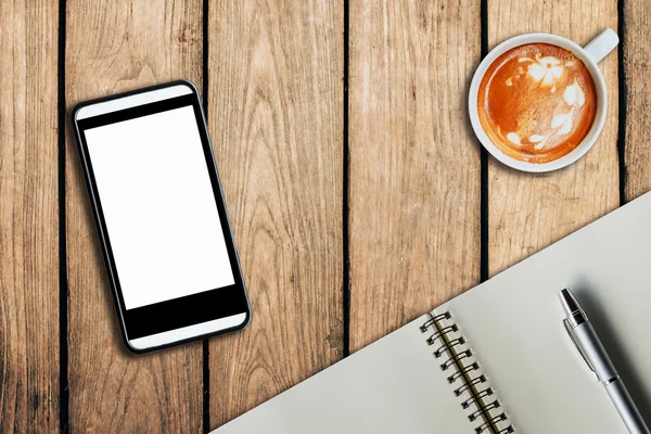 Über Kaffee-Notizbuch mit Telefon auf Holz Tisch Textur — Stockfoto