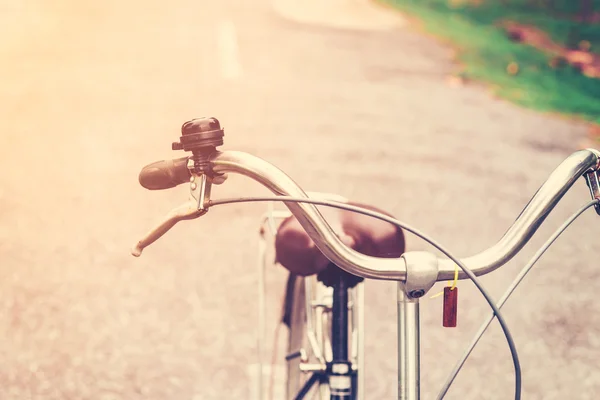 Handlebar vintage bicycle on street road with vintage toned — Stock Photo, Image