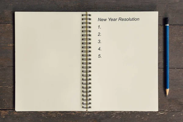Concepto de negocio - Top view notebook writing Año Nuevo Resolución —  Fotos de Stock