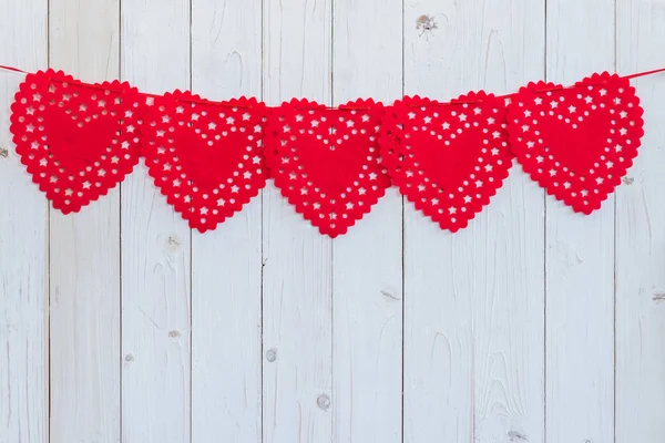 Red heart hanging on white wood for celebration with space. — Stock Photo, Image
