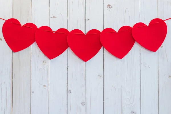 Red heart hanging on white wood for celebration with space. — Stock Photo, Image