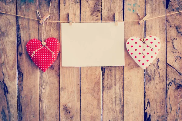 Two heart fabric and paper hanging on clothesline at wood backgr — Stock Photo, Image