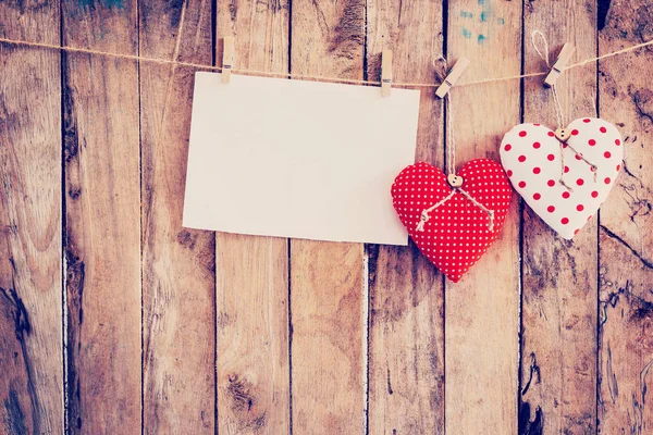 Two heart fabric and paper hanging on clothesline at wood backgr — Stock Photo, Image