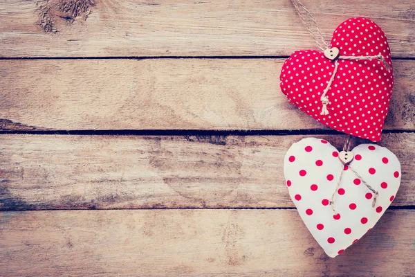 Two heart fabric on wooden table background. — Stock Photo, Image