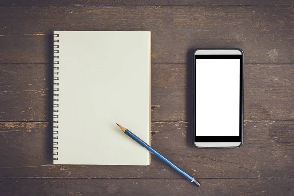 Blank notebook and phone blank screen for advertising on wood