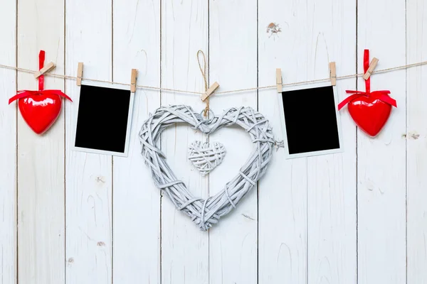 Wooden rustic decorative hearts and photo frame hanging on vinta — Stock Photo, Image