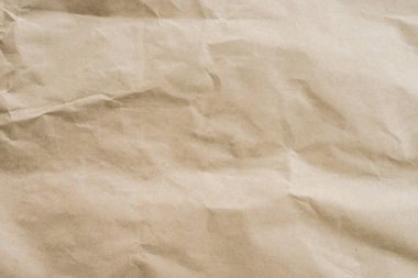 Doku ve arka plan boşluk ile kahverengi kağıt buruşuk.