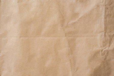 Doku ve arka plan boşluk ile kahverengi kağıt buruşuk.