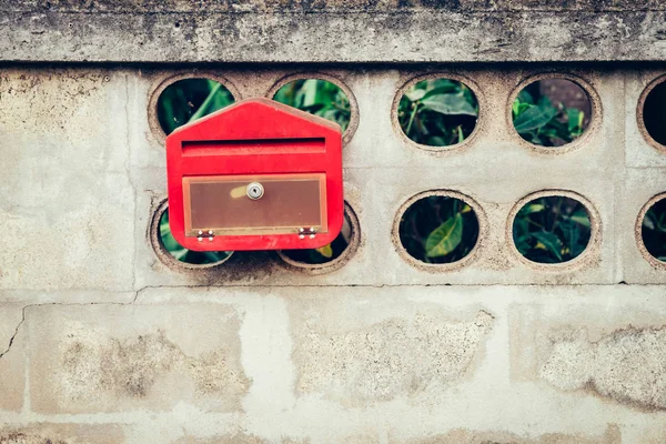 Close up red mail box on cement wall — Stock Photo, Image
