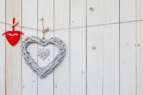 Wooden rustic decorative hearts hanging on vintage wooden backgr — Stock Photo, Image