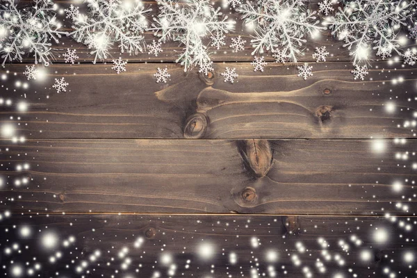 Wooden brown christmas background and snow white with snowflakes — Stock Photo, Image