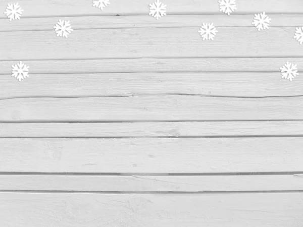 Christmas, New year winter mockup scene with snowflake paper confetti and empty space. White wooden background. Top view. — Stock Photo, Image