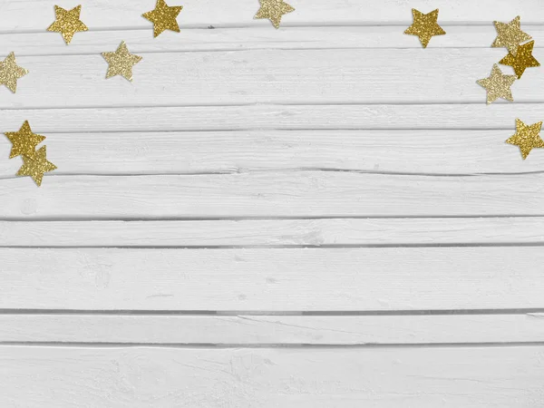 Weihnachten, Silvesterparty-Attrappe mit goldenem Sternchen, glitzerndem Konfetti und leerem Raum. weißer Holzhintergrund. — Stockfoto