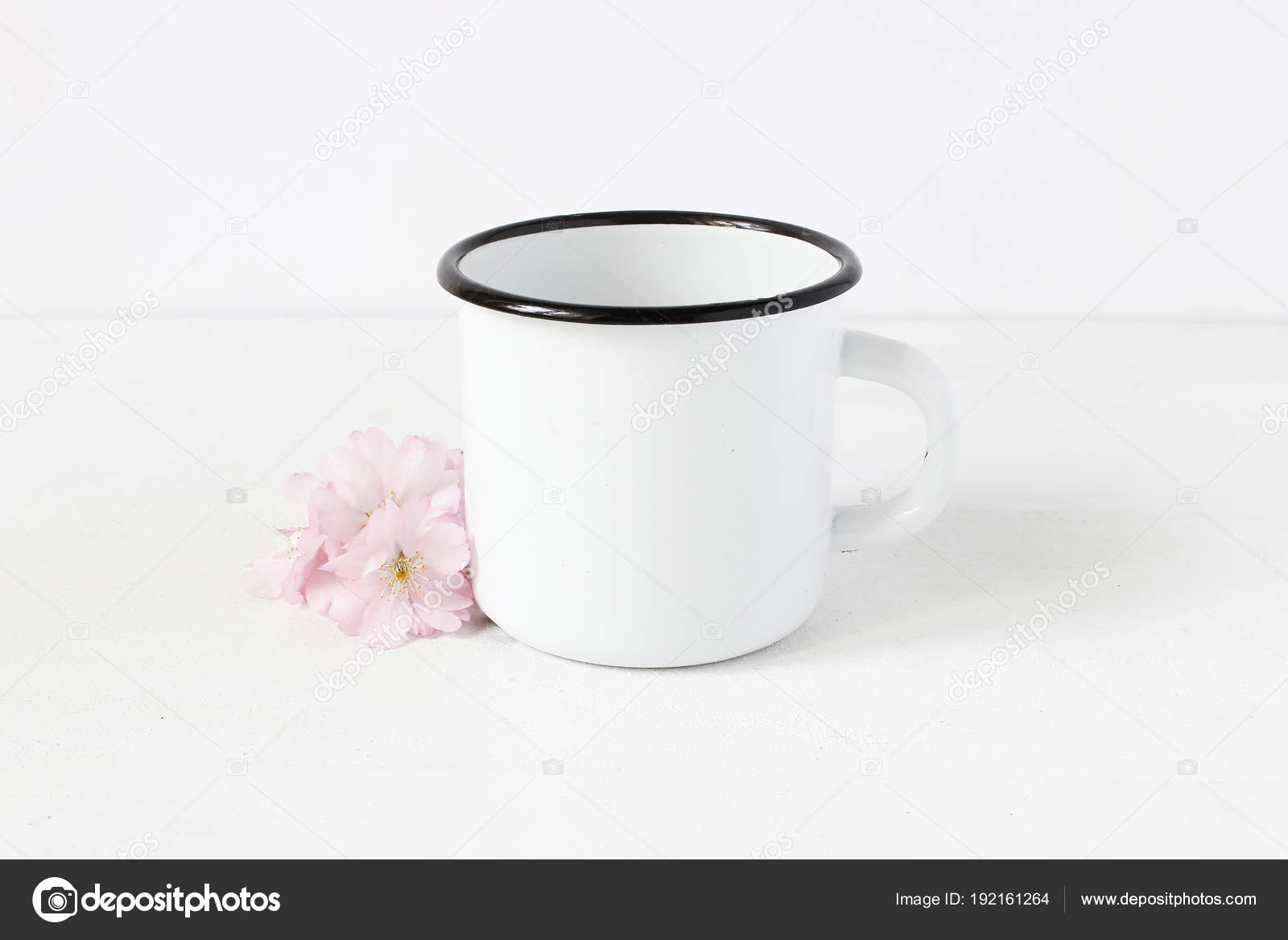 Download Styled Stock Photo Feminine Still Life Composition With Blank White Metal Coffee Enamel Mug And Pink Japanese Cherry Blossoms Flowers On White Table Background Spring Rustic Scene Product Mockup Stock Photo