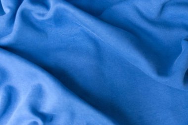 Mavi kumaş dokusu arka plan. Tekstil kumaşı 2020 yılının klasik mavi renginde. Klasik Mavi Pantone rengi. Sığ alan derinliği, seçici odak