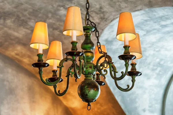 Chandelier on the ceiling. Retro ceiling lamp. Chandelier in the Italian style. Vintage decorations