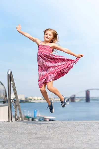 Happy Little Girl Jumping Flying Outdoors River Embankment Summer Vacation — Stock Photo, Image