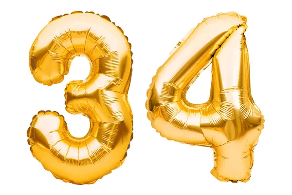 Número 34 treinta y cuatro hechos de globos inflables dorados aislados en blanco. Globos de helio, números de lámina de oro. Decoración de la fiesta, signo de aniversario para las fiestas, celebración, cumpleaños, carnaval — Foto de Stock