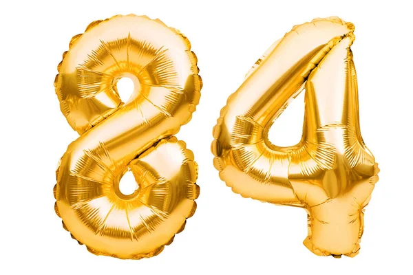 Número 84 ochenta y cuatro de globos inflables dorados aislados en blanco. Globos de helio, números de lámina de oro. Decoración de la fiesta, signo de aniversario para las fiestas, celebración, cumpleaños, carnaval — Foto de Stock