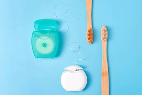 Dental Floss Containers Bamboo Toothbrushes Blue Background Daily Oral Hygiene — Stock Photo, Image