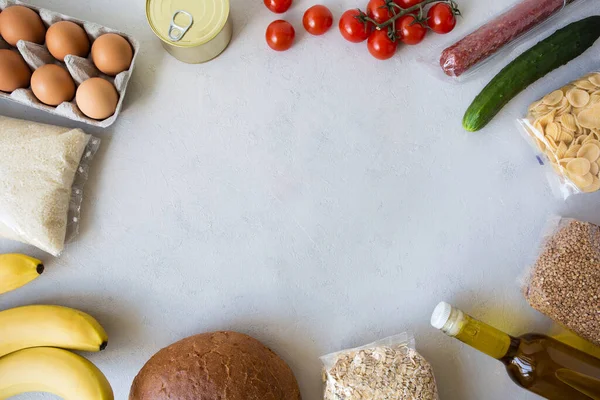 Internet order of nutrition. Food delivery. Contactless online order of goods from the store. Set of grocery items on white background. Takeaway products. Flat lay, copy space, white background.