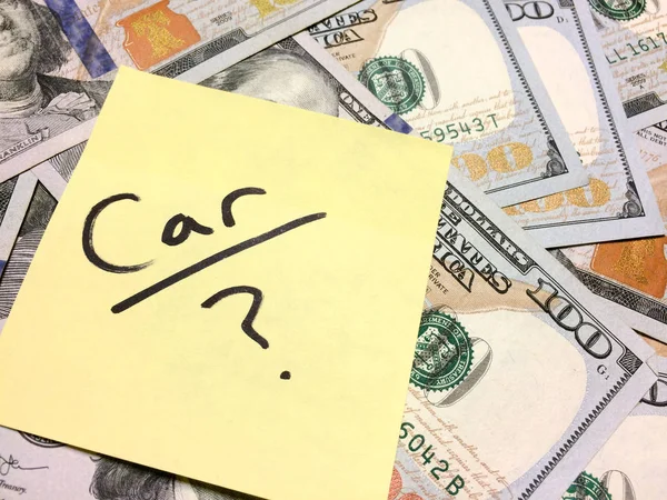 American cash money and yellow sticky note with text Car with question mark — Stock Photo, Image