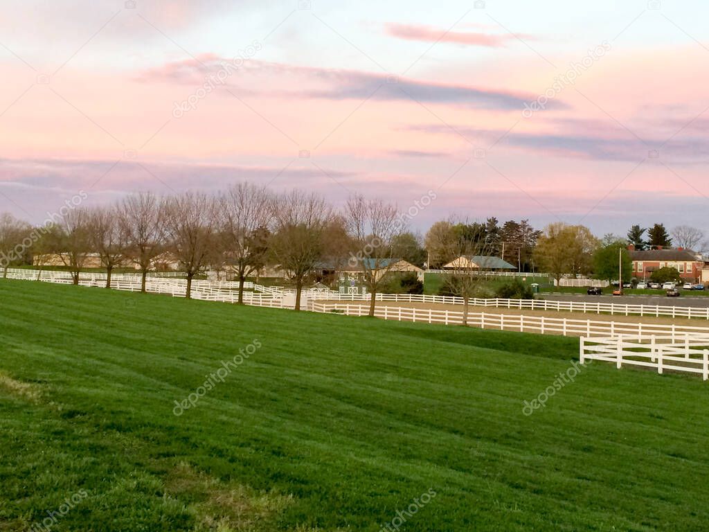 sunset with white vinyl fence