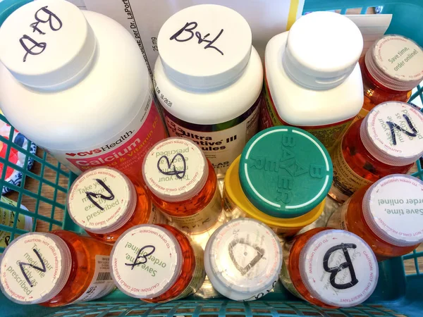 Medicine bottles in tray — Stock Photo, Image