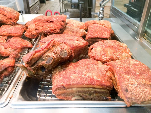 Yummy fried pork with bone in tray lechon baboy — Stock Photo, Image