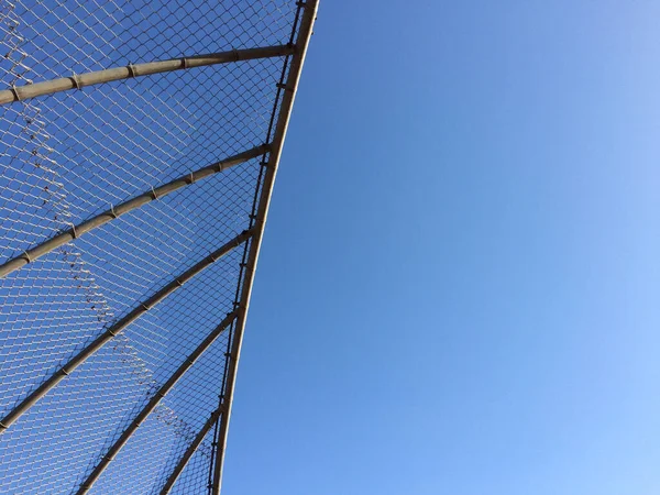 Geometric design element fence and blue sky — Stock Photo, Image
