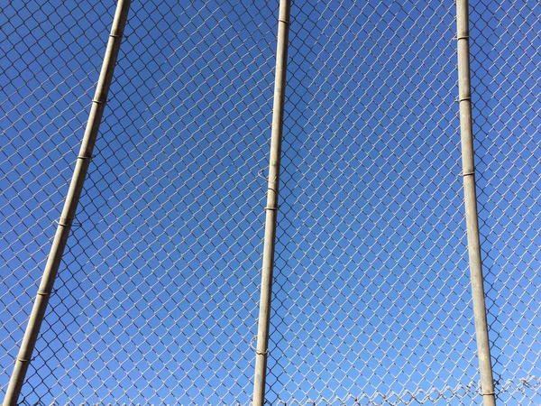 Geometric design element fence and blue sky — Stock Photo, Image