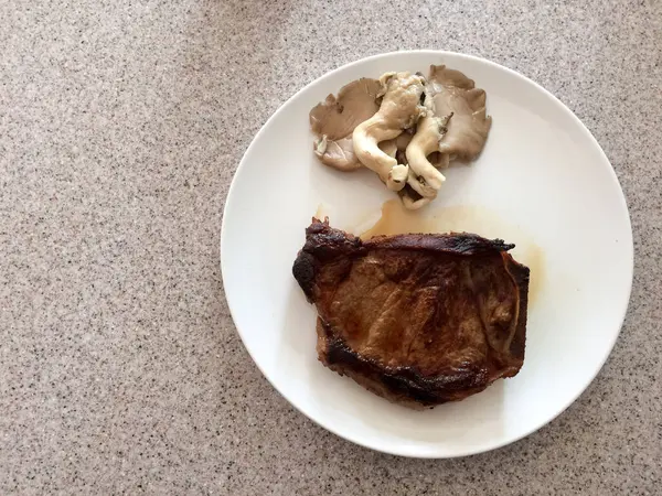 Beef sirloin steak new york ribeye cut with msuhroom — Stock Photo, Image