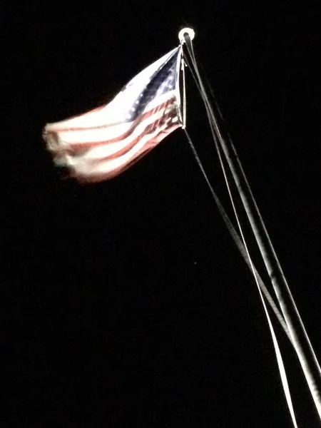 American flag on flagpole motion background black — Stock Photo, Image