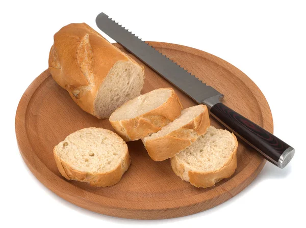 Freshly baked bread on wooden cutting board isolated on white background — Stock Photo, Image