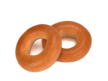 Beyaz arkaplanda taze kuru simit izole edilmiş.