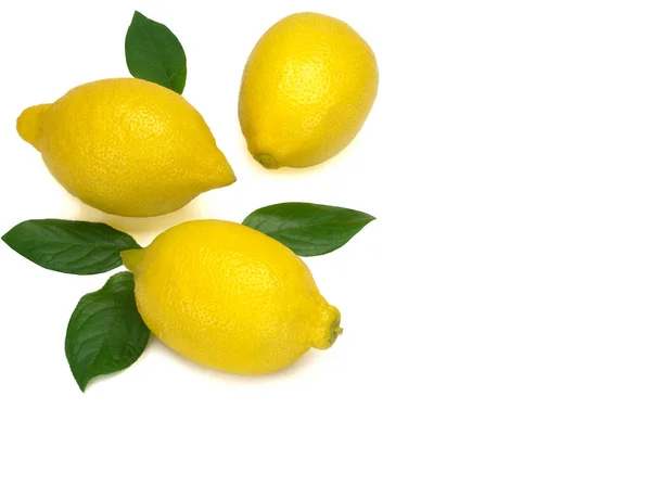 Three whole yellow lemons with green leaves isolated on white background — Stock Photo, Image