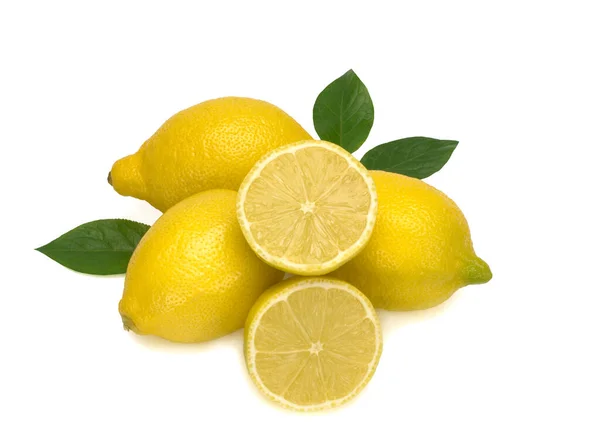 Three whole yellow lemons and two halfs with green leaves isolated on white background — Stock Photo, Image