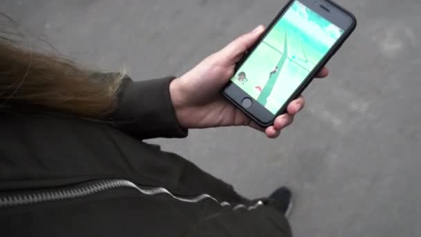 Unidentified Woman Playing Pokemon go — Stock Video