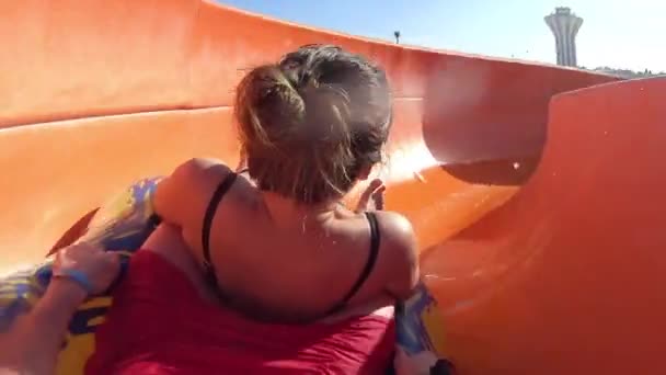 Couple Riding at the Water Slide in the Aqua Park — Stock Video