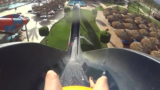 Man Riding Down a Water Slide With Rubber Ring — Stock Video