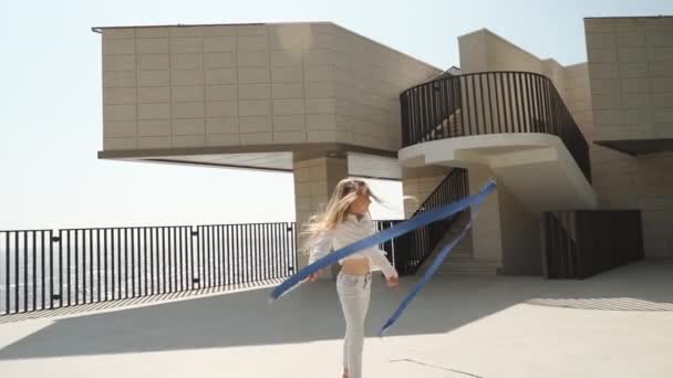 Teen girl making rhythmic exercise with gymnastic tape — Stok video