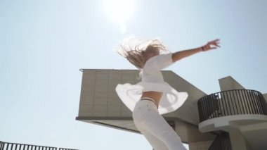 Youth girl dance, spin around, making graceful dancing motions