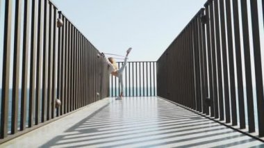 Youth girl standing in position with hula hoop equipment