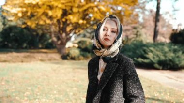 Young adult girl spending autumn weekend day outdoors