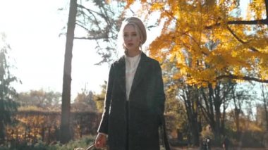 Young adult lady resting in park at sunny day