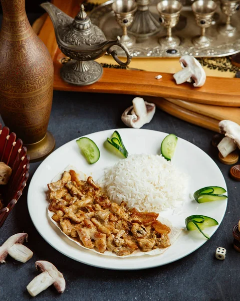 Fried creamy chicken and mushroom served with rice, garnished with — Stock Photo, Image
