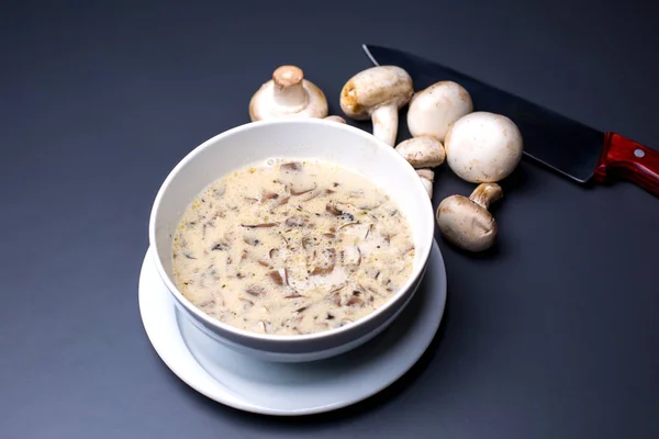 A bowl of creamy mushroom soup in plain background — Stock Image A bowl of creamy mushroom soup in plain background Stock Photo